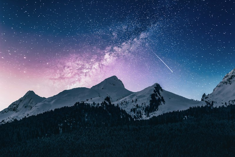 Night sky over snowy peaks